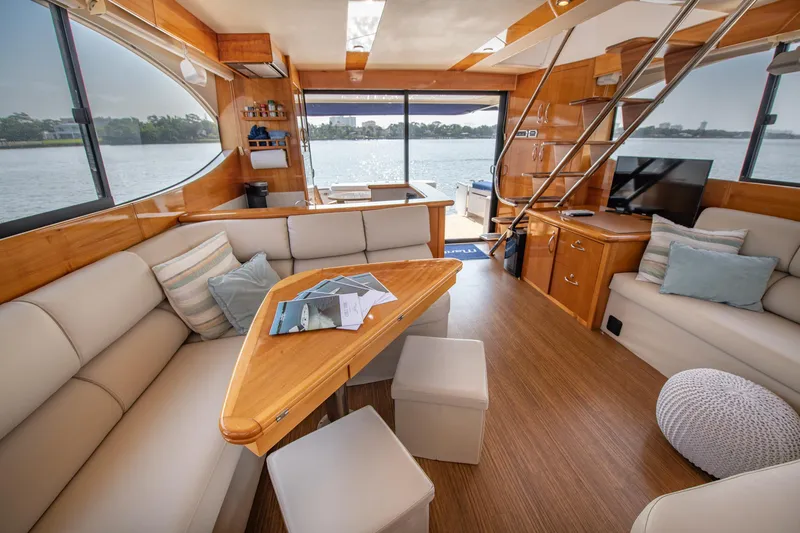 Slide: The Image of Luxurious interior of 2007 Maritimo Enclosed Fly Bridge yacht with comfortable seating and scenic views. - 39
