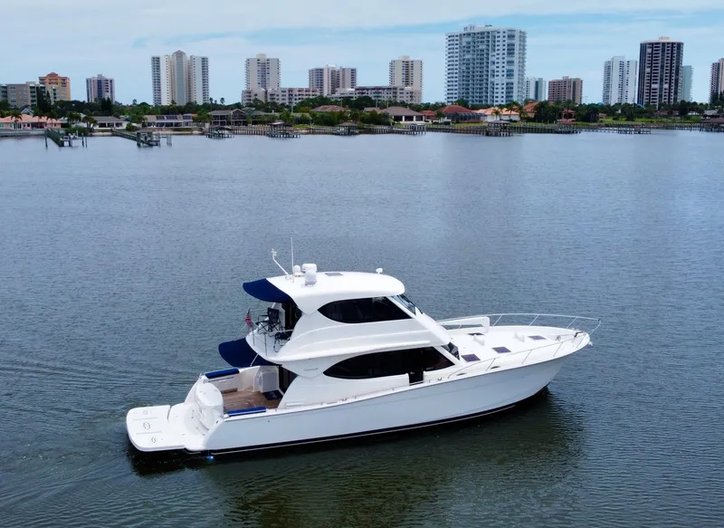 Slide: The Image of 2007 Maritimo Enclosed Fly Bridge yacht cruising on calm waters. - 4