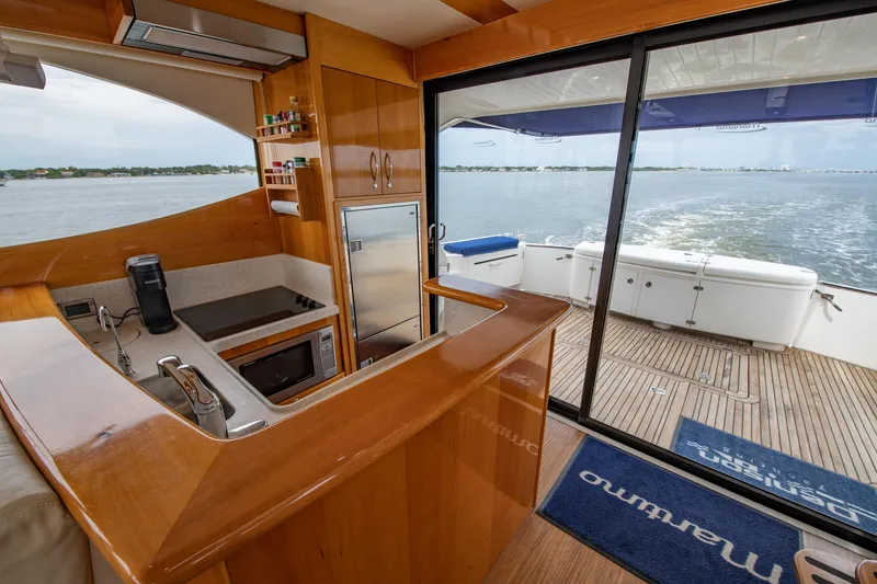 Slide: The Image of 2007 Maritimo Enclosed Fly Bridge yacht interior with kitchen and ocean view. - 41