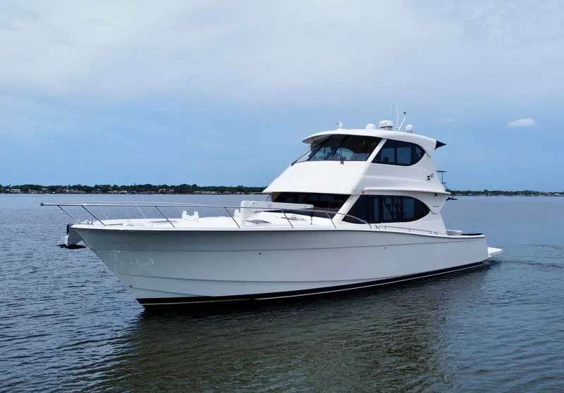 Slide: The Image of 2007 Maritimo Enclosed Fly Bridge yacht cruising on water. - 5