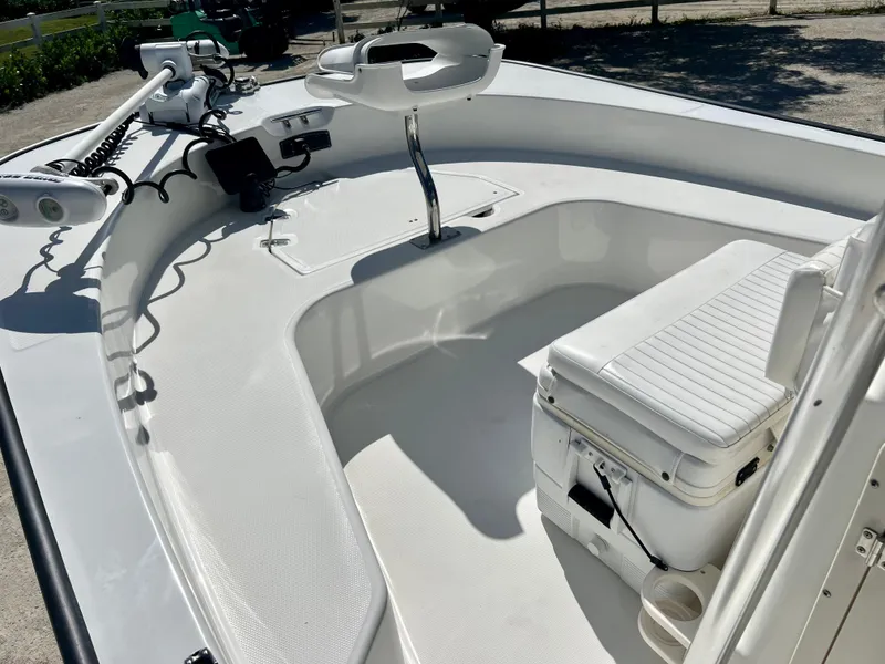 Slide: The Image of 2013 Boston Whaler MONTAUK boat interior with seating and steering console. - 10