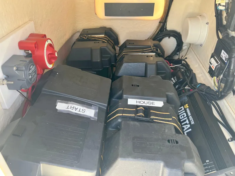 Slide: The Image of Battery compartment of a 2013 Boston Whaler MONTAUK boat with labeled START and HOUSE batteries. - 23