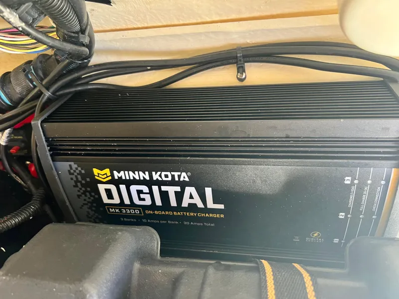 Slide: The Image of Minn Kota Digital MK 330D on-board battery charger in a 2013 Boston Whaler MONTAUK boat. - 24