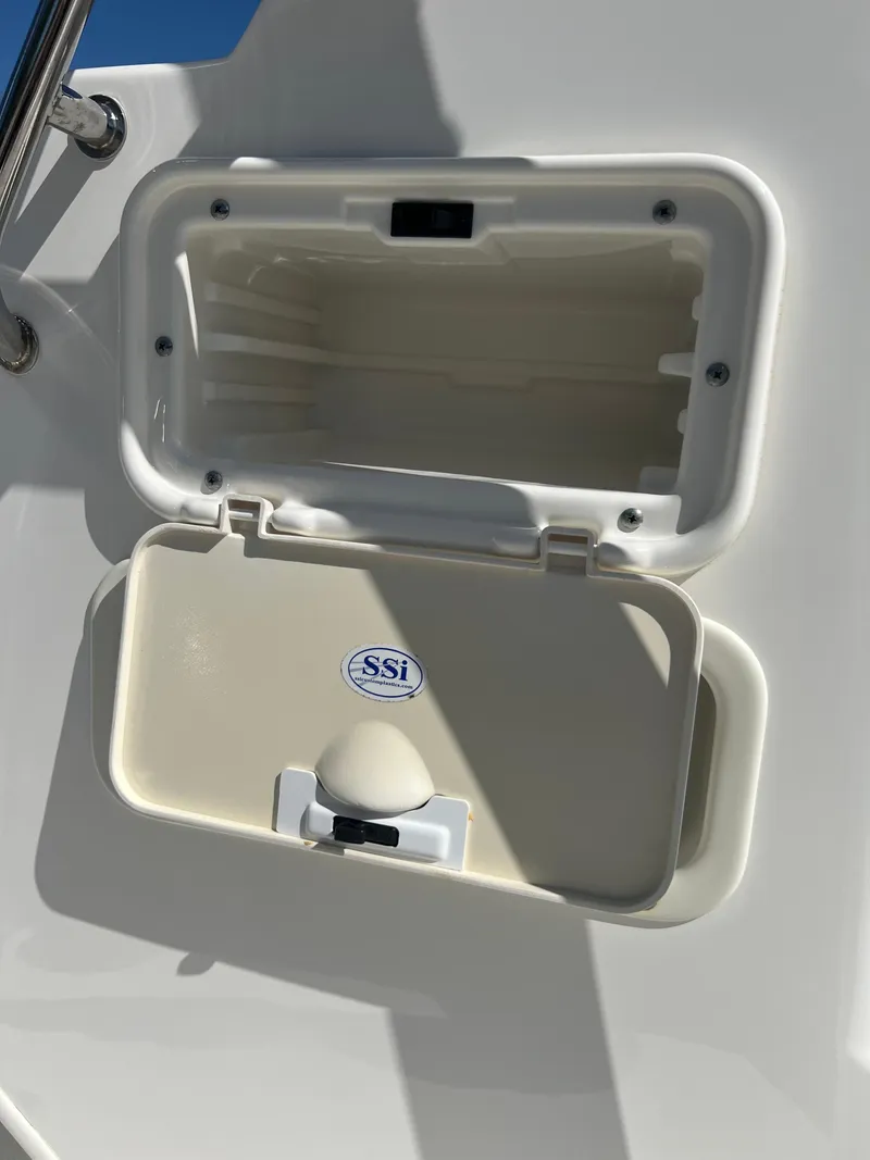 Slide: The Image of Open storage compartment on a 2013 Boston Whaler MONTAUK boat. - 27