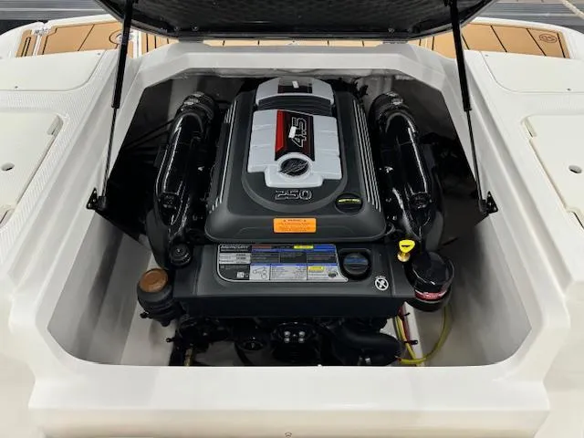 Slide: The Image of 2024 Chaparral 21 SSi boat engine compartment with open hatch. - 17