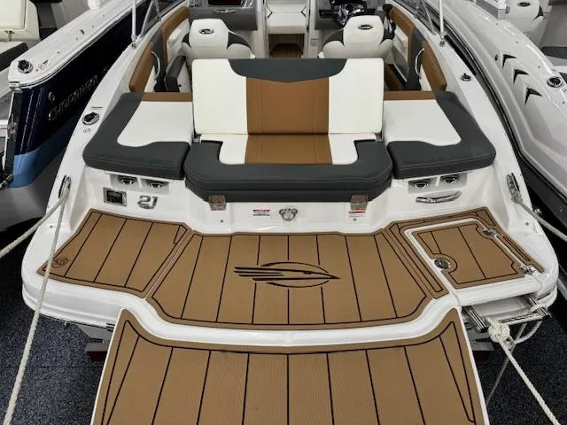 Slide: The Image of 2024 Chaparral 21 SSi boat with tan and black seating and deck. - 19