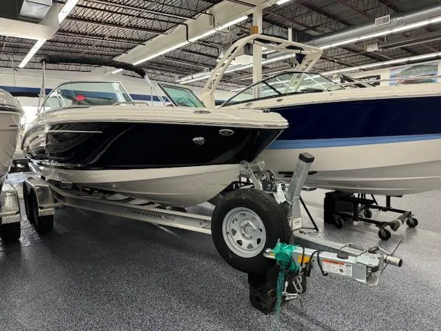 Slide: The Image of 2024 Chaparral 21 SSi boat on a trailer in a showroom. - 3