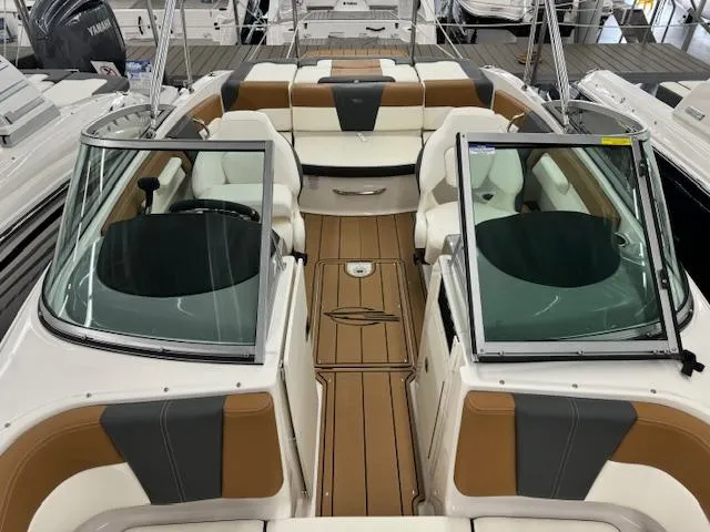 Slide: The Image of 2024 Chaparral 21 SSi boat interior with tan and white seating, open bow design. - 7