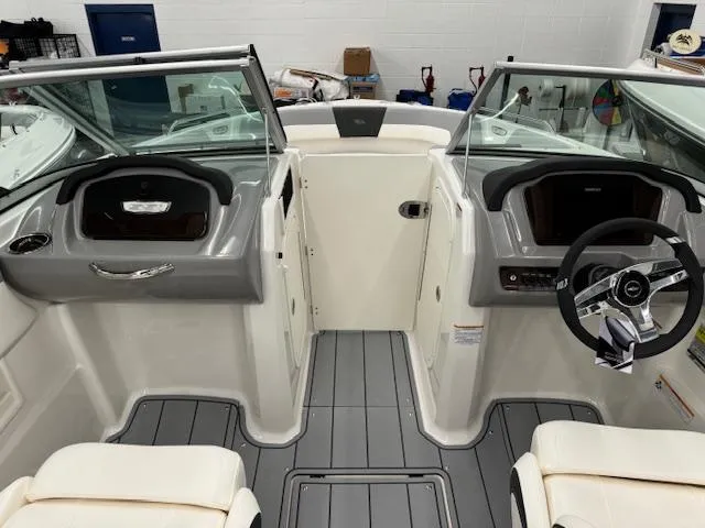 Slide: The Image of 2024 Chaparral 23 SSi boat interior with dual consoles and steering wheel. - 12