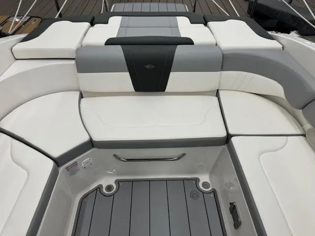 Slide: The Image of 2024 Chaparral 23 SSi boat interior seating with gray and white upholstery. - 15