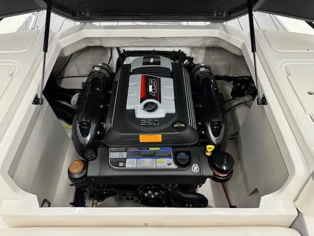 Slide: The Image of 2024 Chaparral 23 SSi boat engine compartment with powerful 250 HP engine. - 21