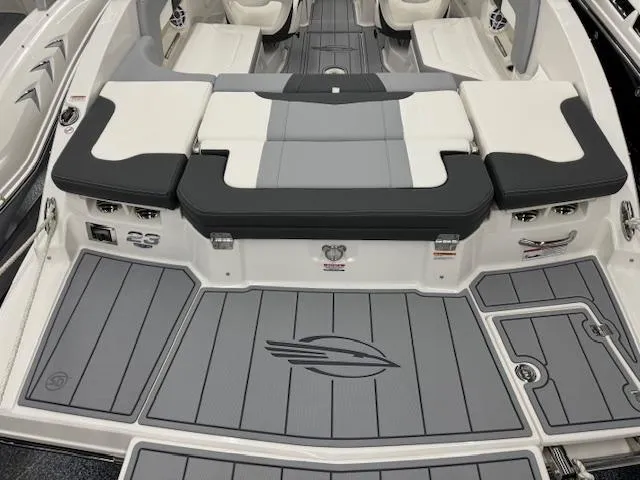 Slide: The Image of 2024 Chaparral 23 SSi boat interior with gray and white seating and flooring. - 25