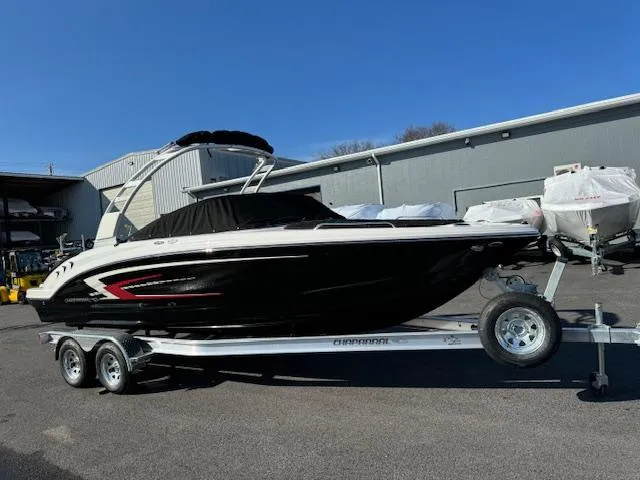 Slide: The Image of 2024 Chaparral 23 SSi boat on a trailer in a marina. - 26