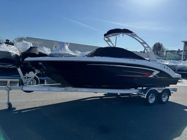 Slide: The Image of 2024 Chaparral 23 SSi boat on a trailer in a marina. - 27