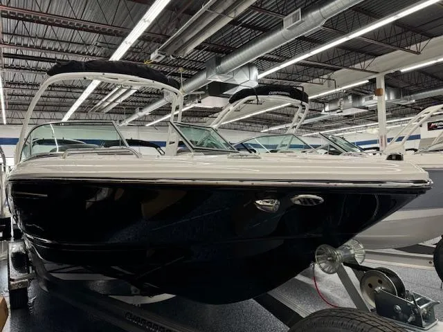 Slide: The Image of 2024 Chaparral 23 SSi boat on display in a showroom. - 3