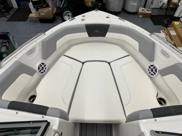 Slide: The Image of 2024 Chaparral 23 SSi boat interior with white and gray seating. - 6