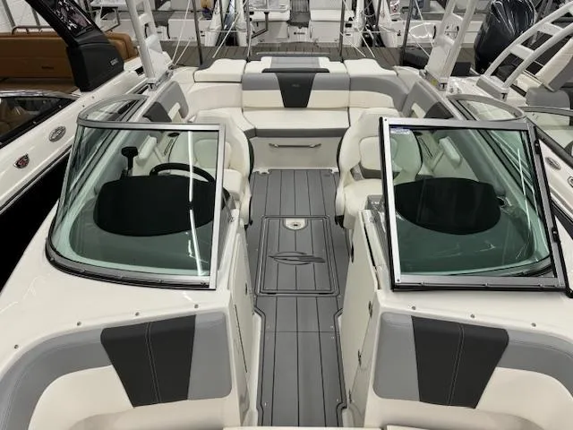 Slide: The Image of 2024 Chaparral 23 SSi boat interior with open windshield and seating. - 7