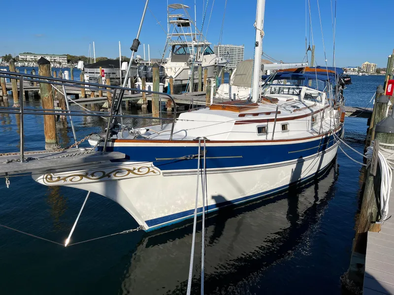 The Image of Gozzard 36 sailboat, 1990 model, docked at a marina on a sunny day. - 1