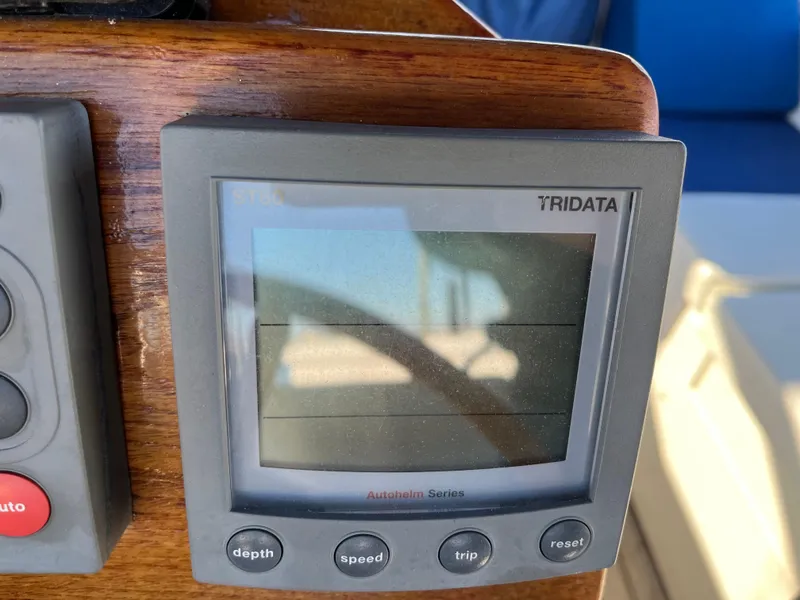 Slide: The Image of Gozzard 36 sailboat 1990 model with Tridata navigation display showing depth, speed, and trip data. - 28