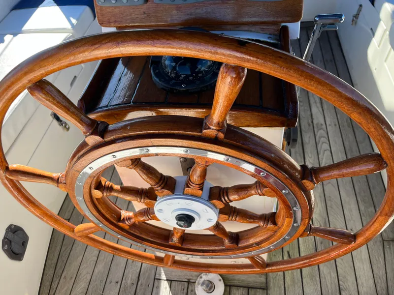 Slide: The Image of Wooden helm of a 1990 Gozzard 36 sailboat. - 30