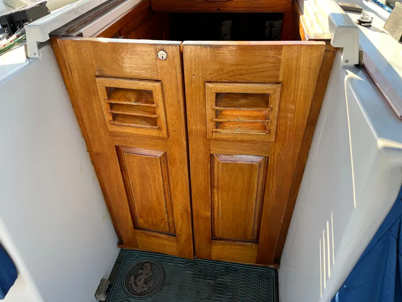 Slide: The Image of Wooden cabin doors on a 1990 Gozzard 36 sailboat. - 36