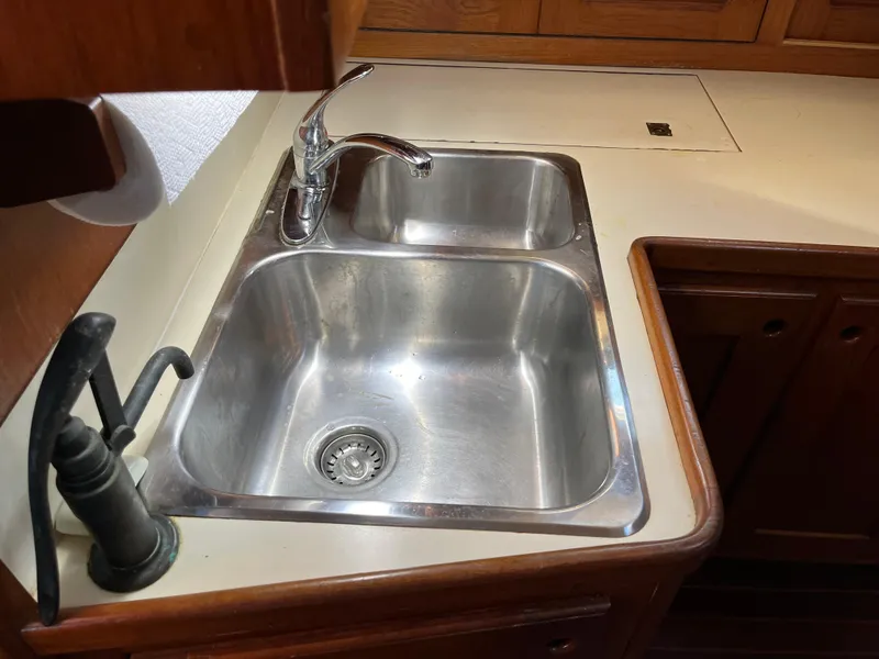 Slide: The Image of Stainless steel double sink in the kitchen of a 1990 Gozzard 36 sailboat. - 37