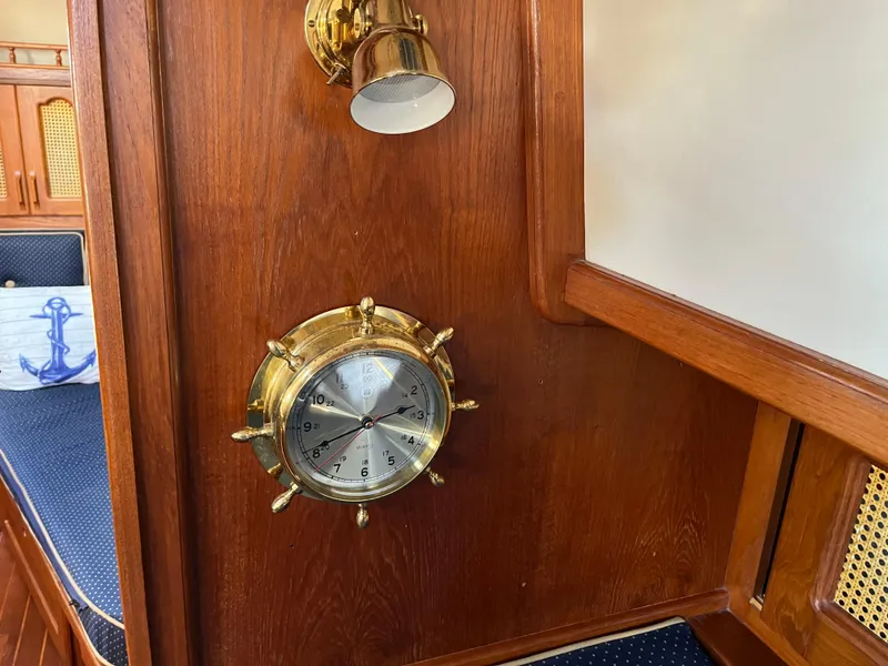 Slide: The Image of Brass nautical clock on wooden interior of 1990 Gozzard 36 sailboat. - 42