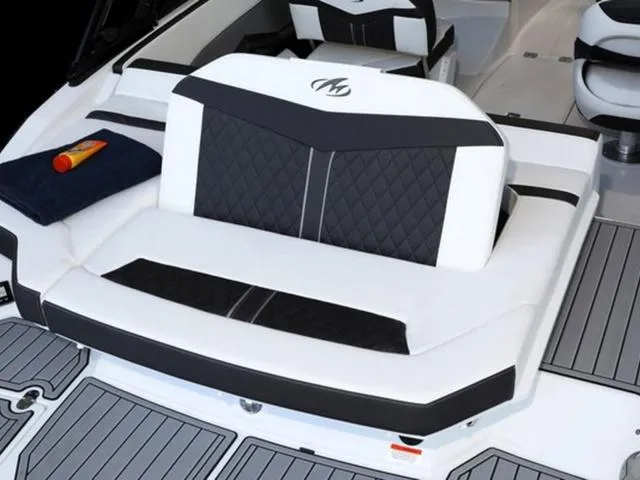 Slide: The Image of 2024 Monterey 218SS boat interior with cushioned seating and deck. - 4