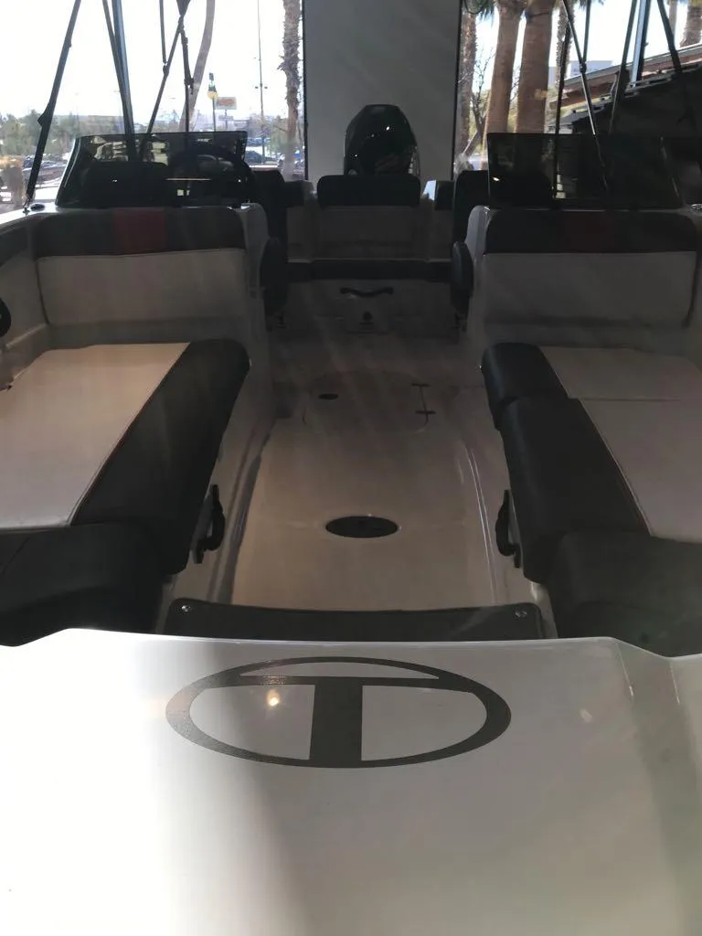 Slide: The Image of 2024 Tahoe T21 boat interior with spacious seating and sleek design. - 5
