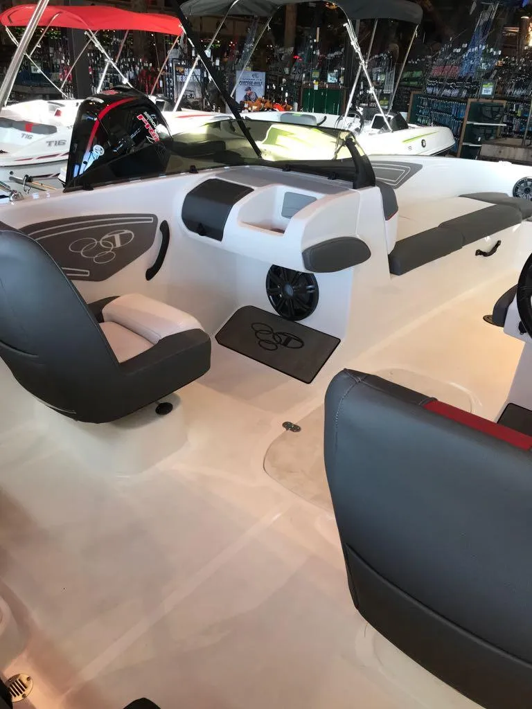 Slide: The Image of 2024 Tahoe T21 boat interior with sleek seating and modern design. - 9