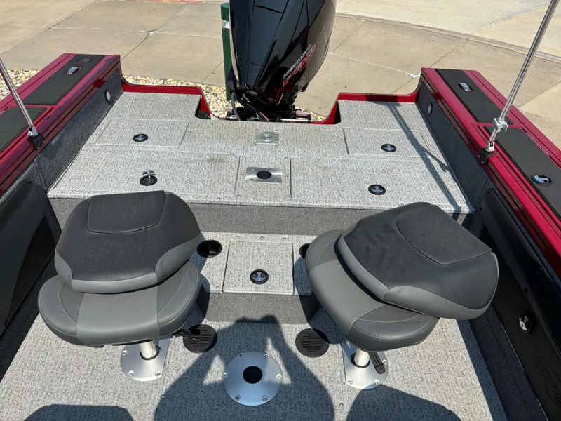 Slide: The Image of 2024 Tracker Targa V-19 WT boat interior with two seats and motor. - 4