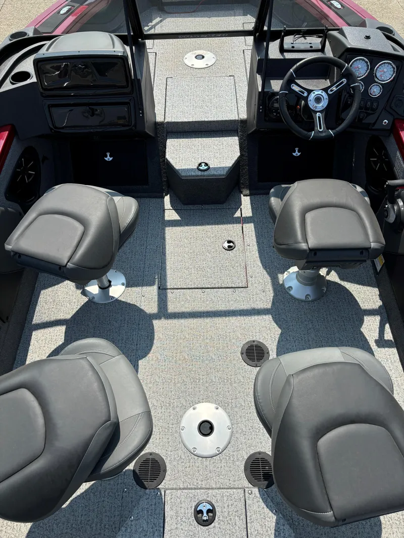 Slide: The Image of 2024 Tracker Targa V-19 WT boat interior with four seats and steering console. - 6