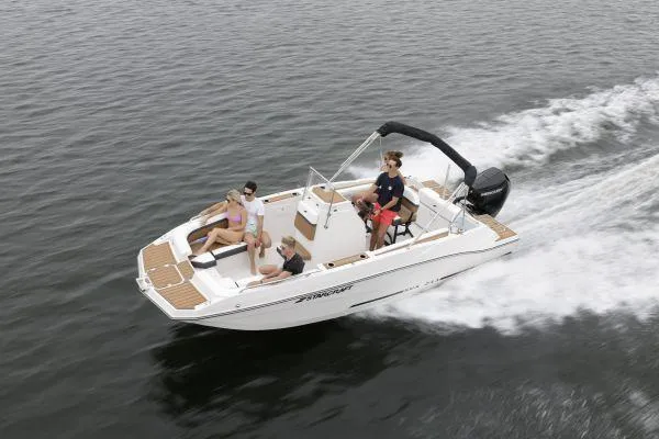 Slide: The Image of 2024 Starcraft SVX 211 OB boat cruising on water with passengers enjoying the ride. - 15