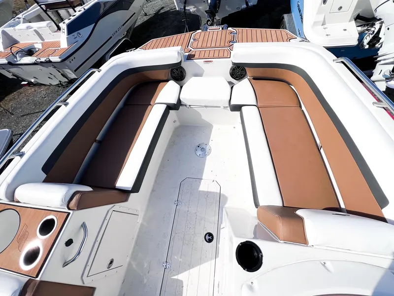 Slide: The Image of 2024 Starcraft SVX 211 OB boat interior with brown and white seating. - 5