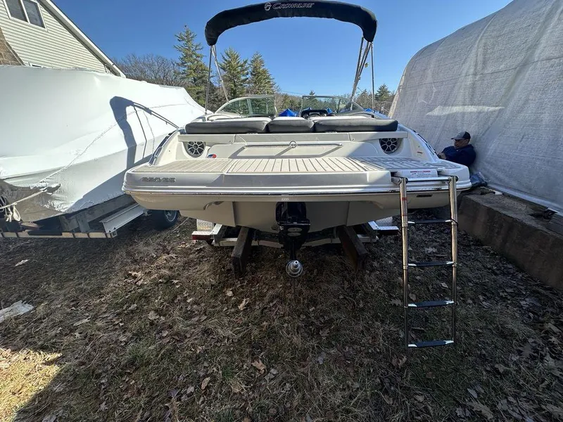 Slide: The Image of 2024 Crownline SS Series 220 boat with swim platform and ladder. - 11