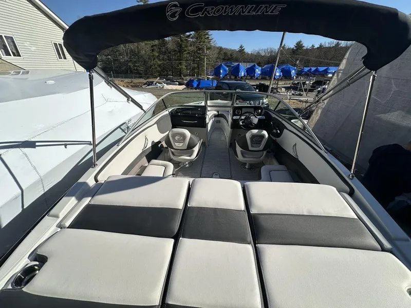 Slide: The Image of 2024 Crownline SS Series 220 boat interior with seating and canopy. - 4