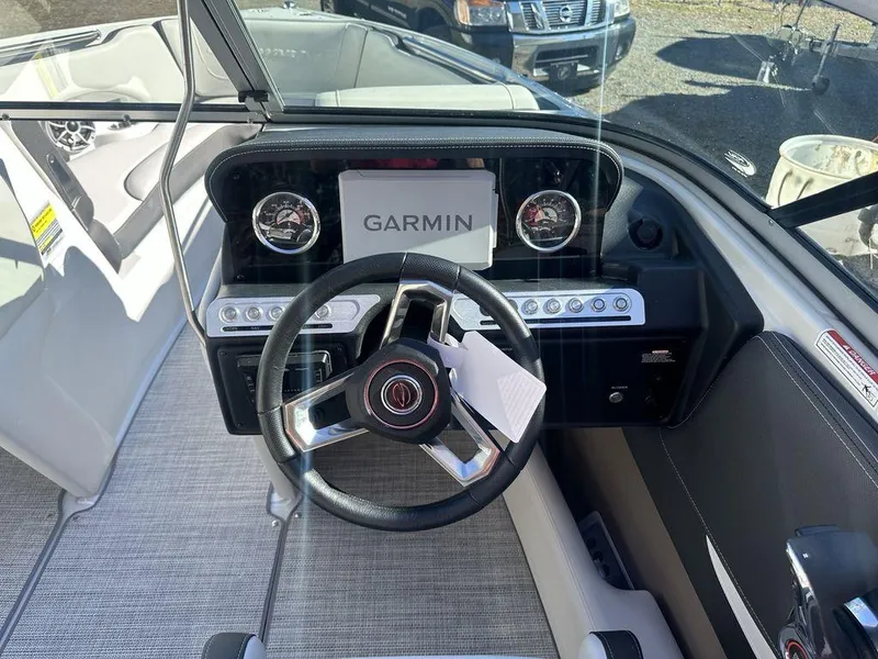 Slide: The Image of 2024 Crownline SS Series 220 boat dashboard with Garmin navigation system. - 5