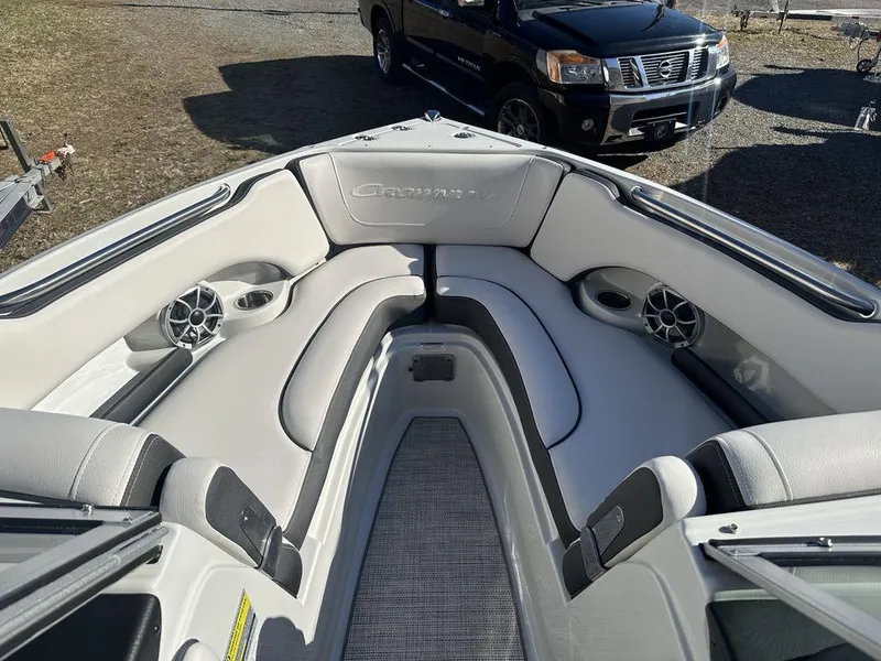 Slide: The Image of 2024 Crownline SS Series 220 boat interior with cushioned seating and built-in speakers. - 6