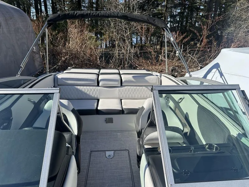 Slide: The Image of 2024 Crownline SS Series 220 boat interior with seating and windshield. - 8