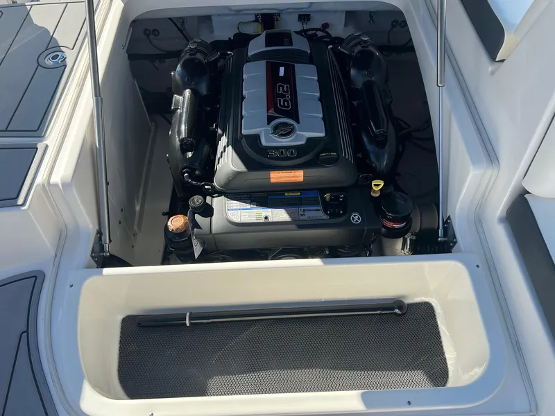 Slide: The Image of 2024 Chaparral 247 SSX boat engine compartment with visible engine components. - 4