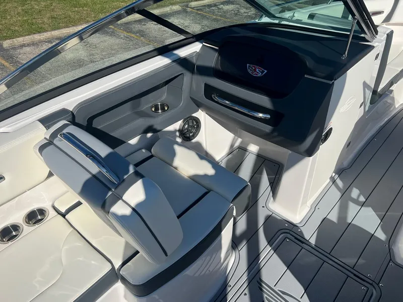 Slide: The Image of 2024 Chaparral 247 SSX boat interior with sleek seating and modern dashboard. - 5