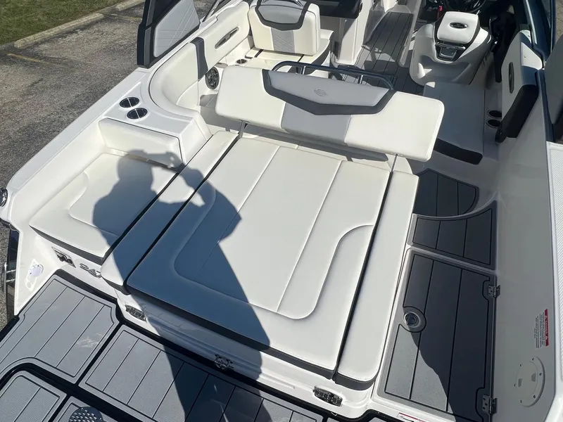 Slide: The Image of 2024 Chaparral 247 SSX boat interior with white seating and modern design. - 7