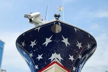 Slide: The Image of 2005 SeaCraft SC32 Master Angler boat with starry design and radar equipment. - 1