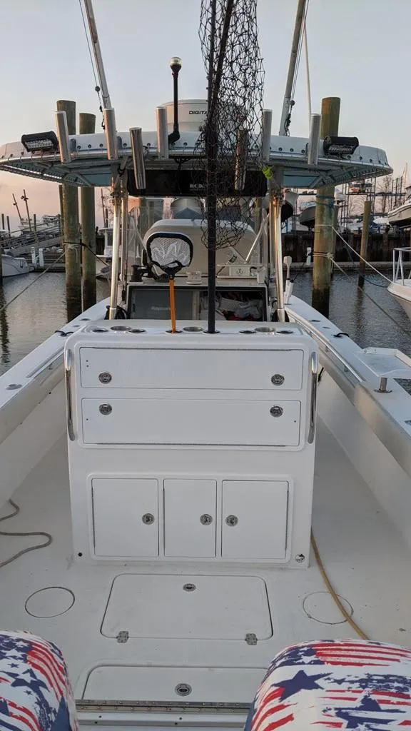 Slide: The Image of 2005 SeaCraft SC32 Master Angler boat with fishing gear at a marina. - 12