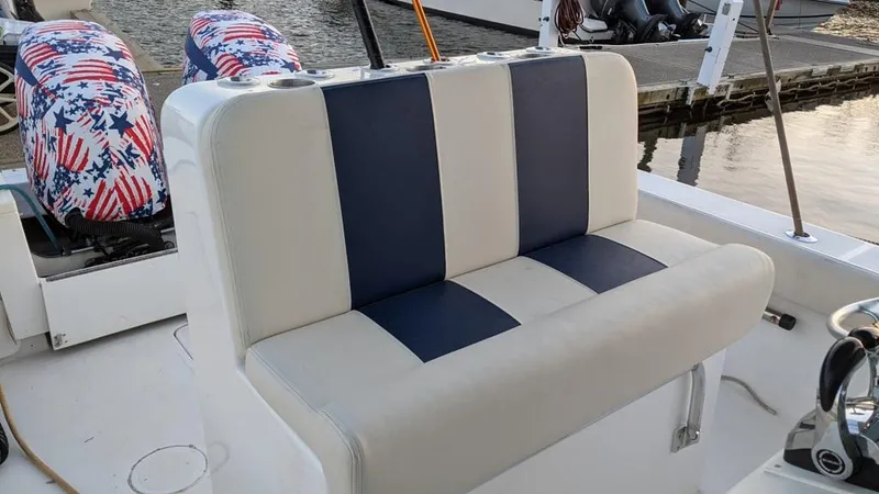 Slide: The Image of 2005 SeaCraft SC32 Master Angler boat with striped seating and patriotic covers. - 14