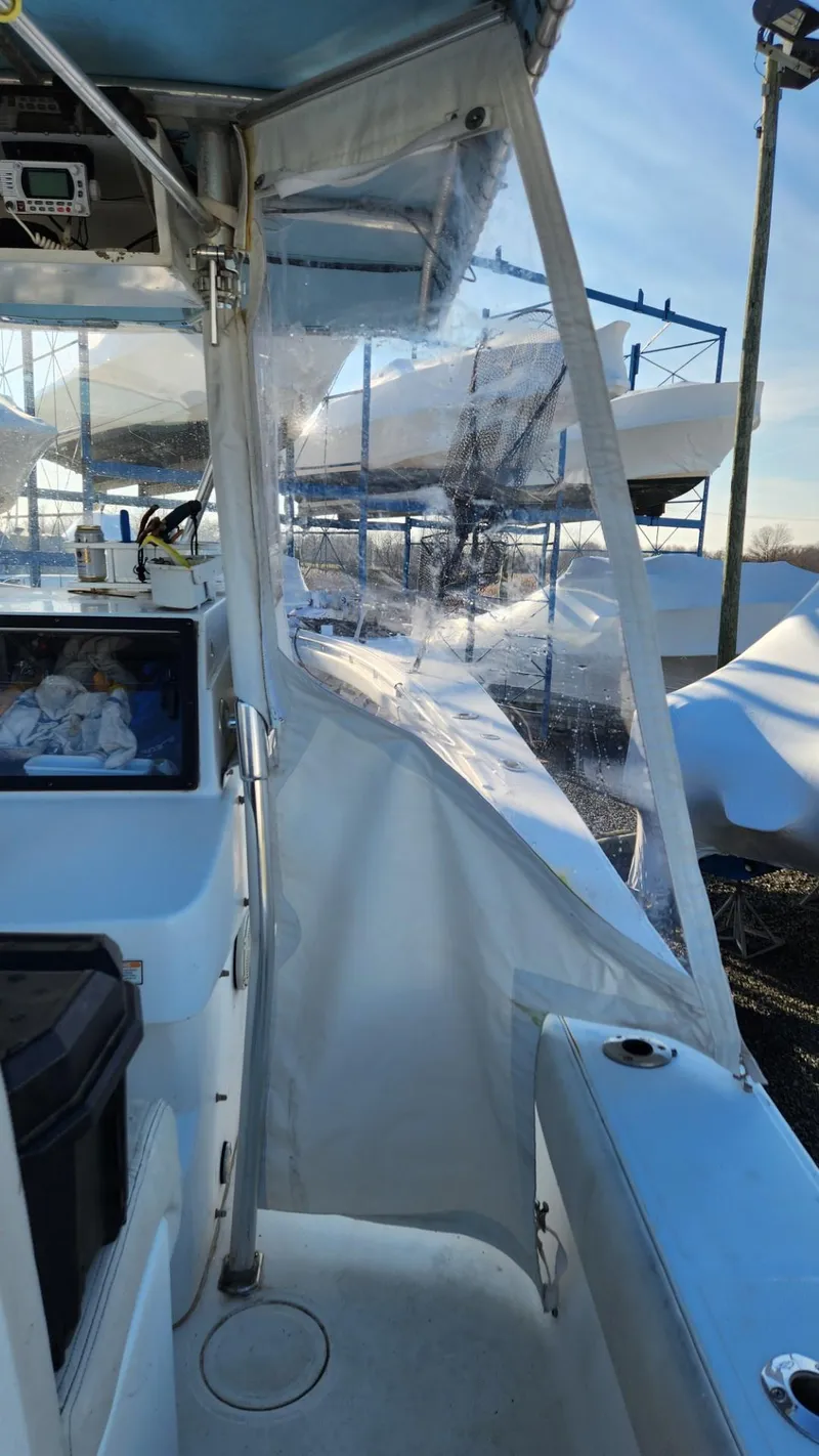 Slide: The Image of 2005 SeaCraft SC32 Master Angler boat with clear canopy and sleek design. - 18