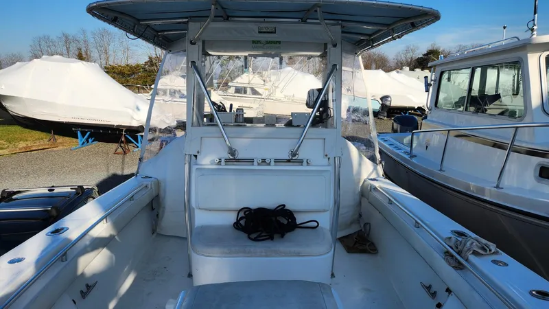 Slide: The Image of 2005 SeaCraft SC32 Master Angler boat interior with seating and covered deck. - 19
