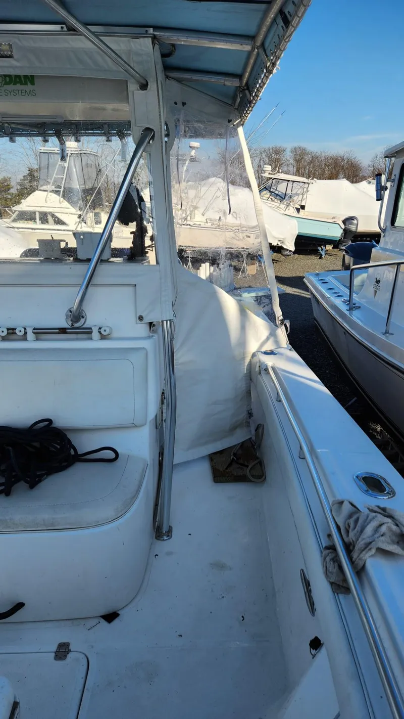 Slide: The Image of 2005 SeaCraft SC32 Master Angler boat interior with seating and canopy. - 20