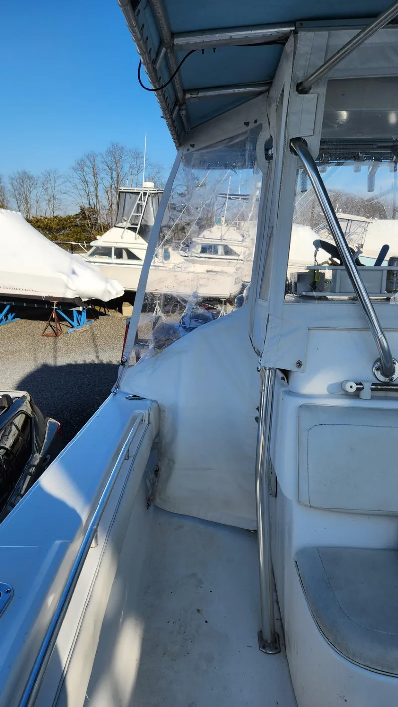 Slide: The Image of 2005 SeaCraft SC32 Master Angler boat docked, showcasing interior and exterior features. - 21