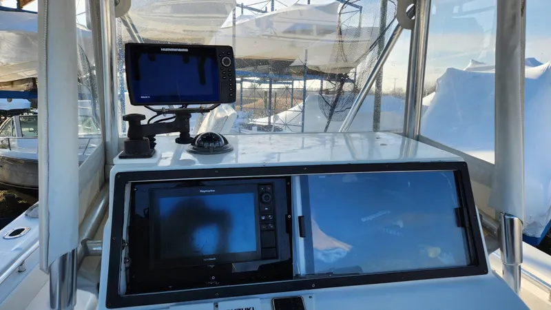 Slide: The Image of 2005 SeaCraft SC32 Master Angler boat dashboard with navigation equipment. - 22